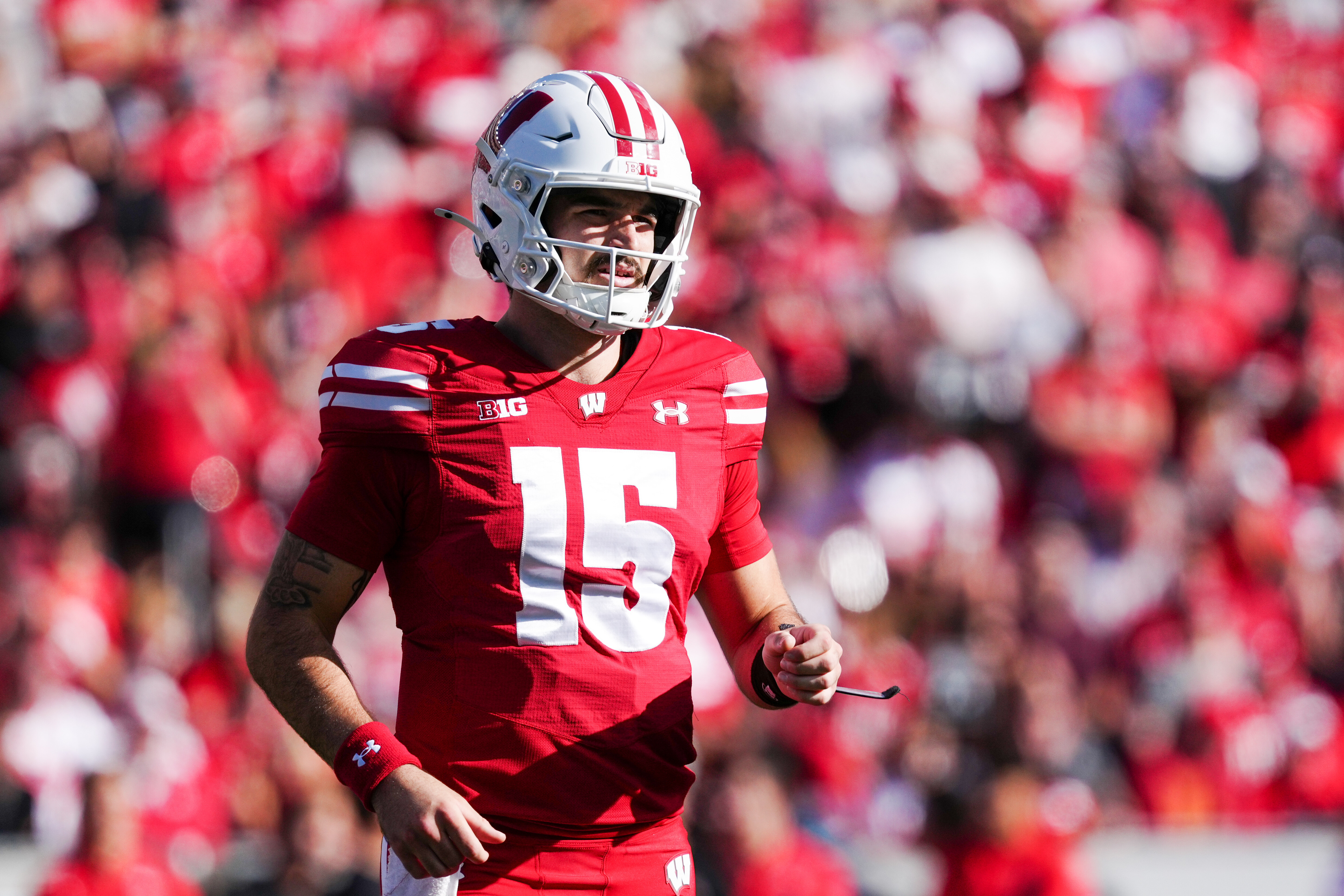 Oct 18, 2025; Madison, Wisconsin, USA; Wisconsin Badgers quarterback Hunter Simmons (15) looks to the sidelines for a play call during the first half against the Ohio State Buckeyes at Camp Randall Stadium on October 18, 2025 in Madison, Wisconsin. Photography by Ross Harried for Second Crop Sports.